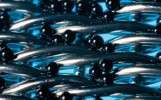 Macro photo shot; a filter braid illuminated with blue light; the glass bead test