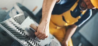 Floor tiler at work
