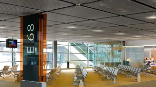 Wall and ceiling covering made out of stainless steel wire mesh with integrated ceiling lighting.