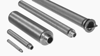 Five cylindrical stainless‑steel filter candles of different sizes with Porostar mesh laminate and threaded connections on a white background.