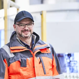 A man looks at performance data for the machine