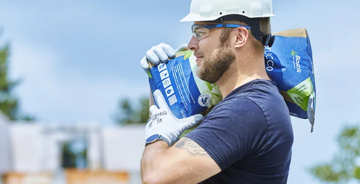 Man carrying a welded bag