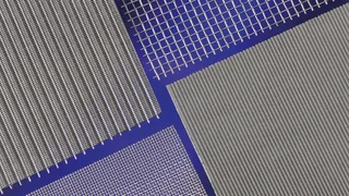 Various metal mesh types in close-up, differently woven, silver‑shining on a blue background, by Haver & Boecker.