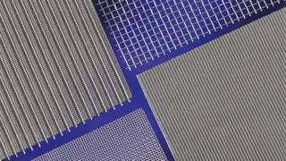 Various metal mesh types in close-up, differently woven, silver‑shining on a blue background, by Haver & Boecker.