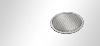 Multi-layered filter discs with edge zone compression