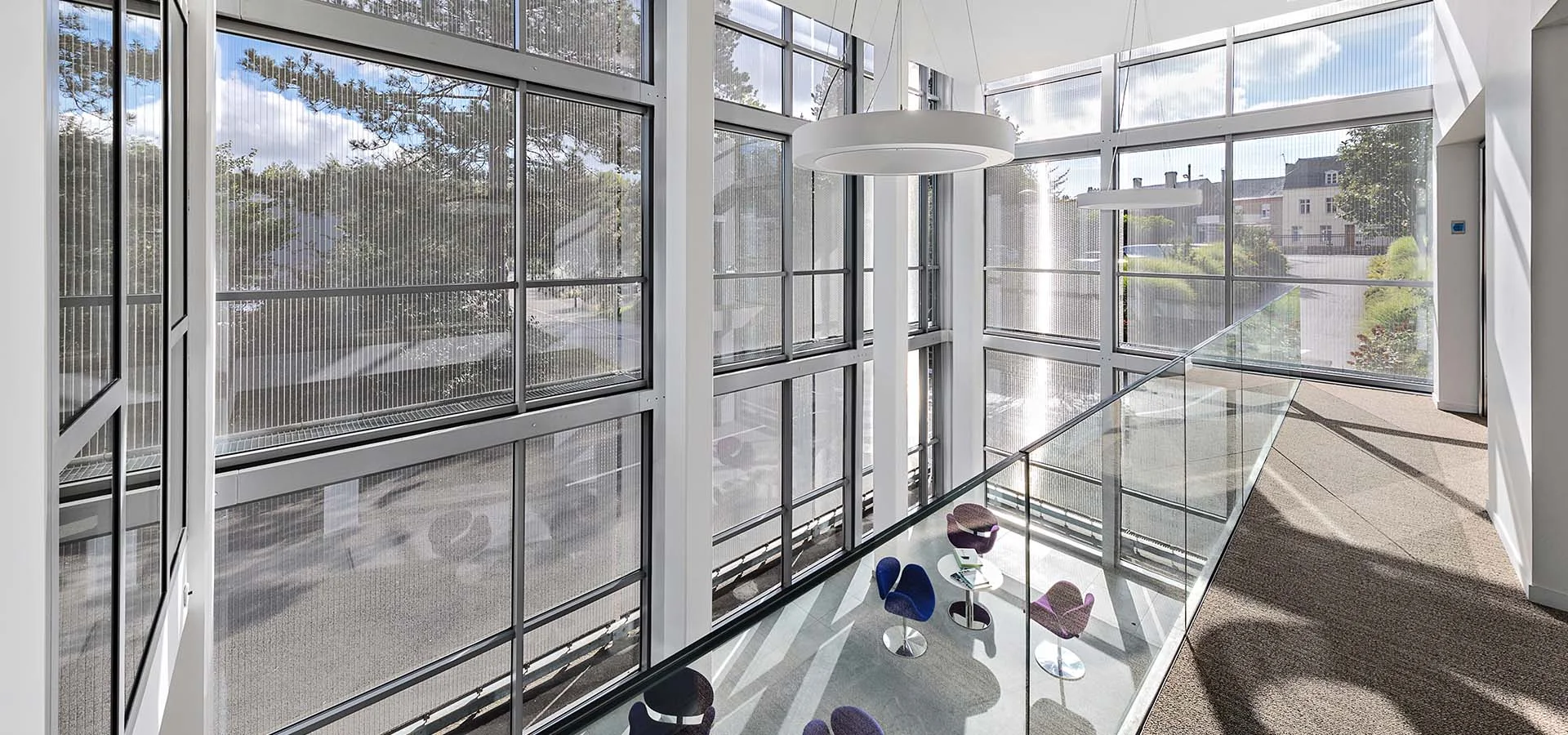 A semi-transparent façade cladding using HAVER architectural wire mesh View to the outside: Facade cladding with HAVER architectural mesh