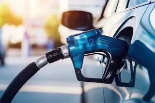 Close-up of a fuel cell vehicle with connected hydrogen tap