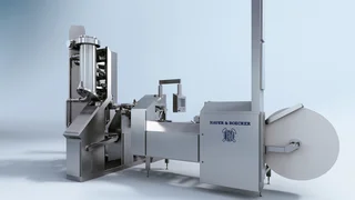 ROTO-PACKER® ADAMS® CARE-LINE EDITION: Geschlossene Edelstahlanlage mit einem Füllstutzen und Rollenmagazin.