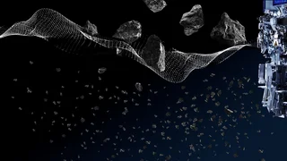 Maschinenteil mit Drahtgewebe links, durch das grobe Gesteinsstücke fallen; moderner Industrieprozess von Haver & Boecker.